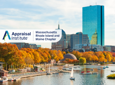 This image features the Boston skyline, highlighted by the distinct blue glass of the Prudential Tower with the Appraisal Institute Massachusetts Rhode Island and Maine Chapter Logo