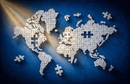 Puzzles world map on blue wall background.