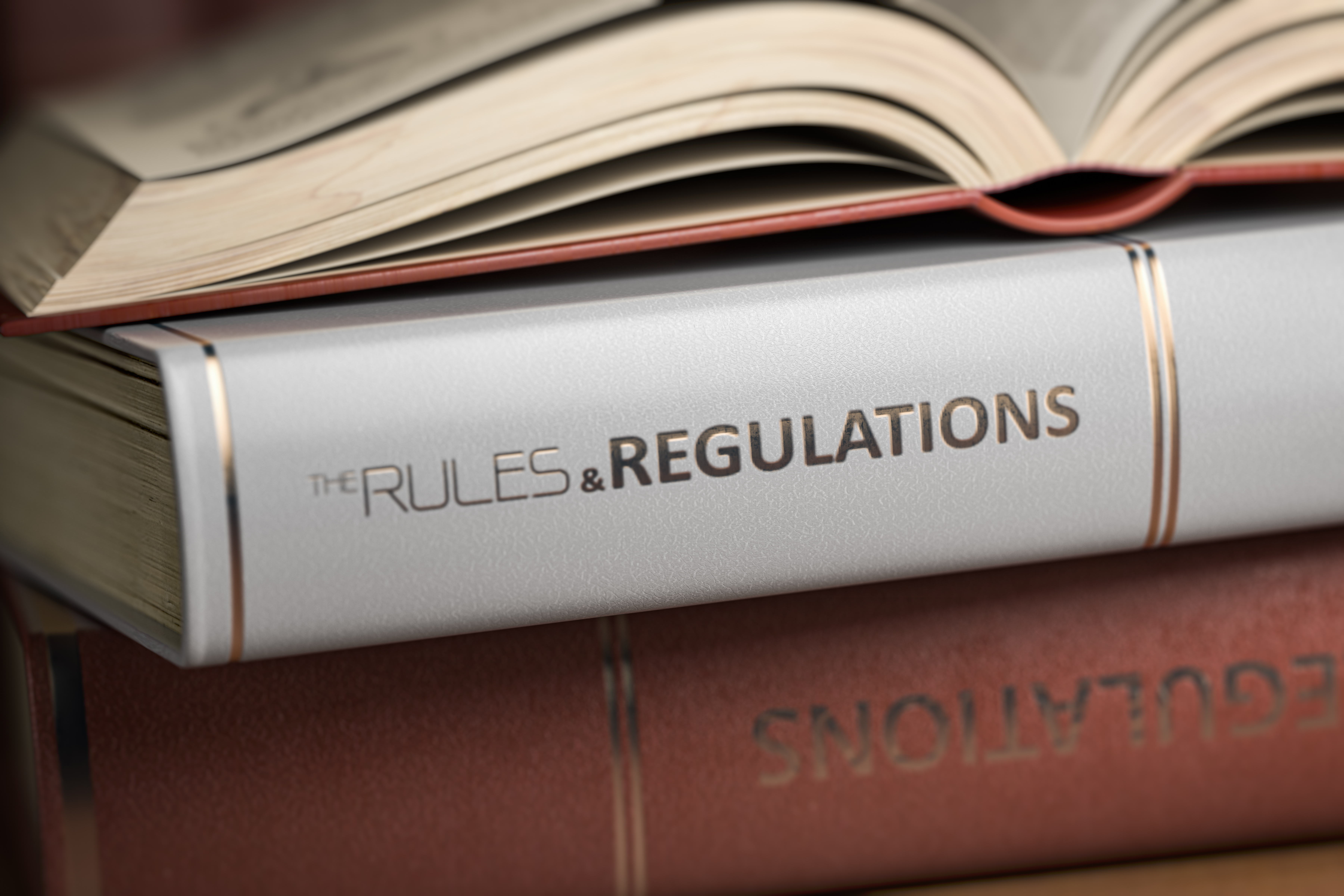 books with rules and regulations on the binding