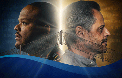 An image of two men of different races divided by a fence.