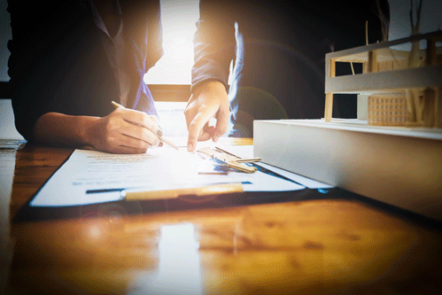 Estate agent gives pen and documents agreement with customer to sign contract. Concept agreement.