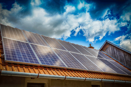 Solar panel on a red roof.