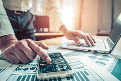 Businessman accountant or financial expert analyze business report graph and finance chart at corporate office. Concept of finance economy, banking business and stock market research.