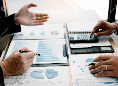 appraisers analyzing automobile dealership finances nF