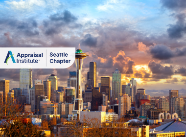 The image features the iconic Space Needle rising above the downtown Seattle, Washington skyline with the Appraisal Institute Seattle Chapter Logo