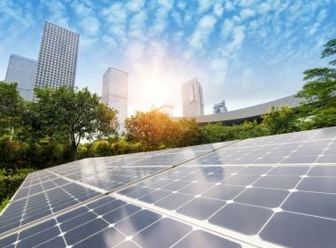 solar panels and bright blue skies with skyscrapers to demo clean renewable energy for sustainable urban technology